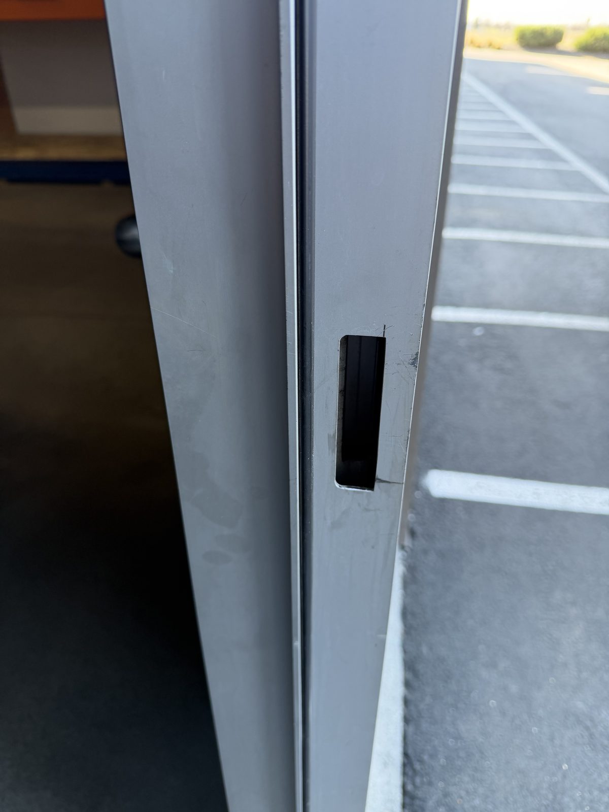 Properly adjusted door latch and strike plate on RC Roofing commercial door