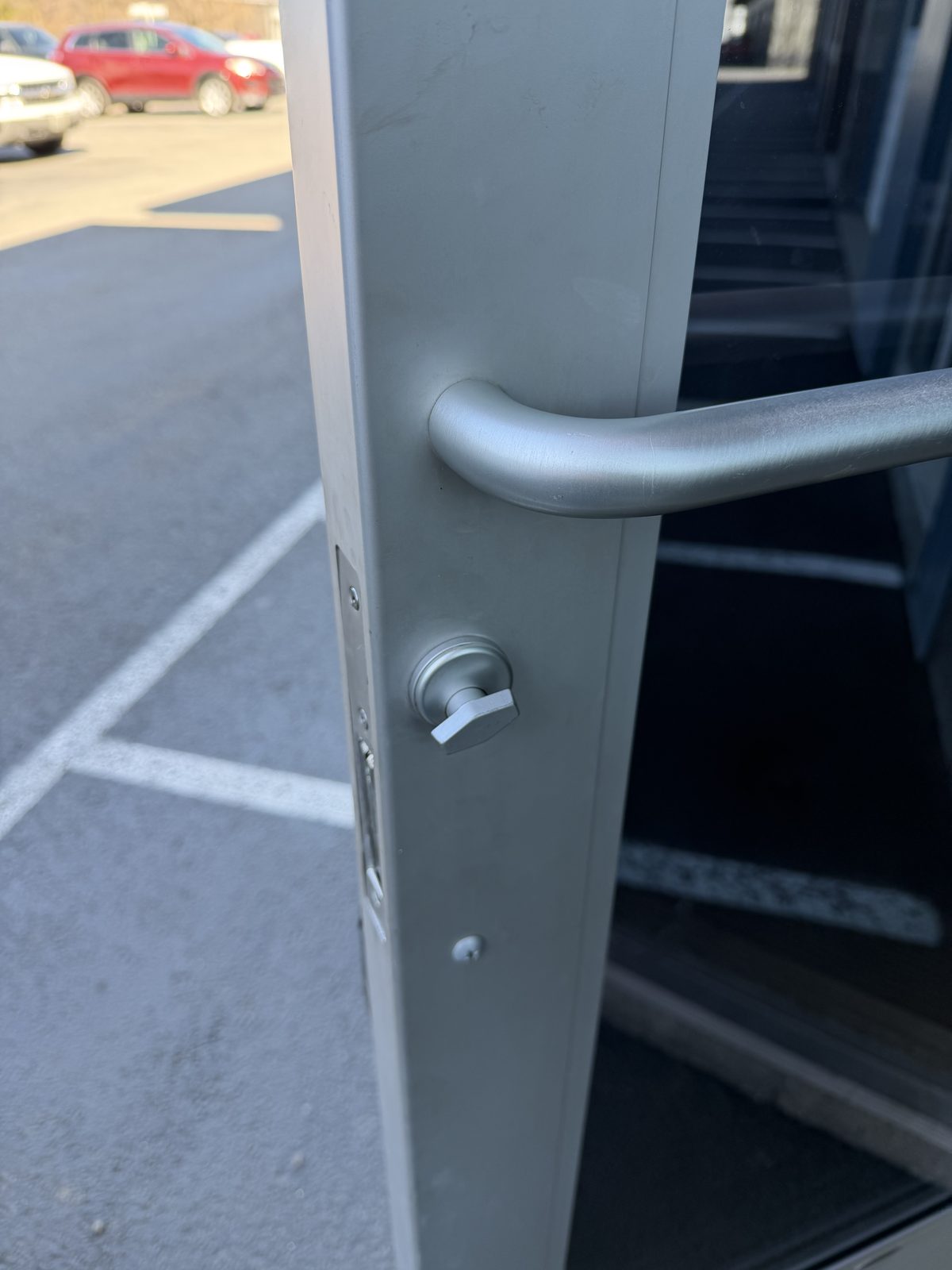 New mortise cylinder with thumbturn properly installed on commercial door